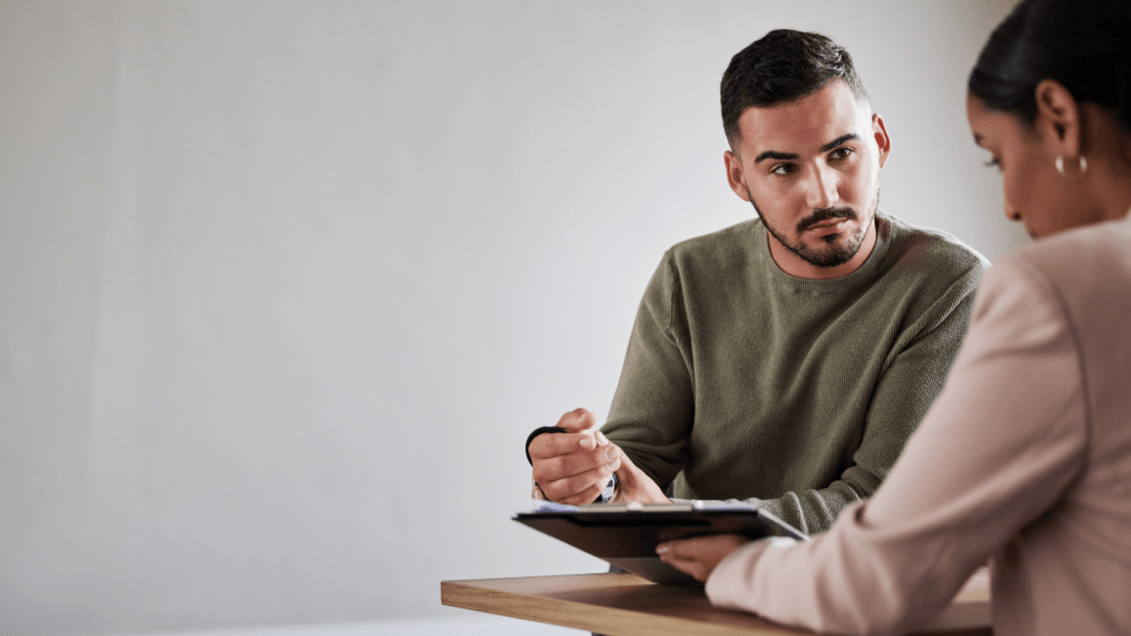 two people discussing compliance